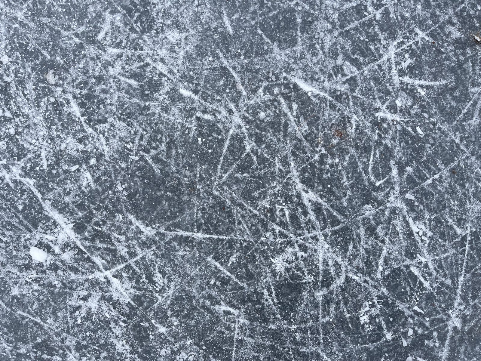 Scratches on the surface of ice on a pond