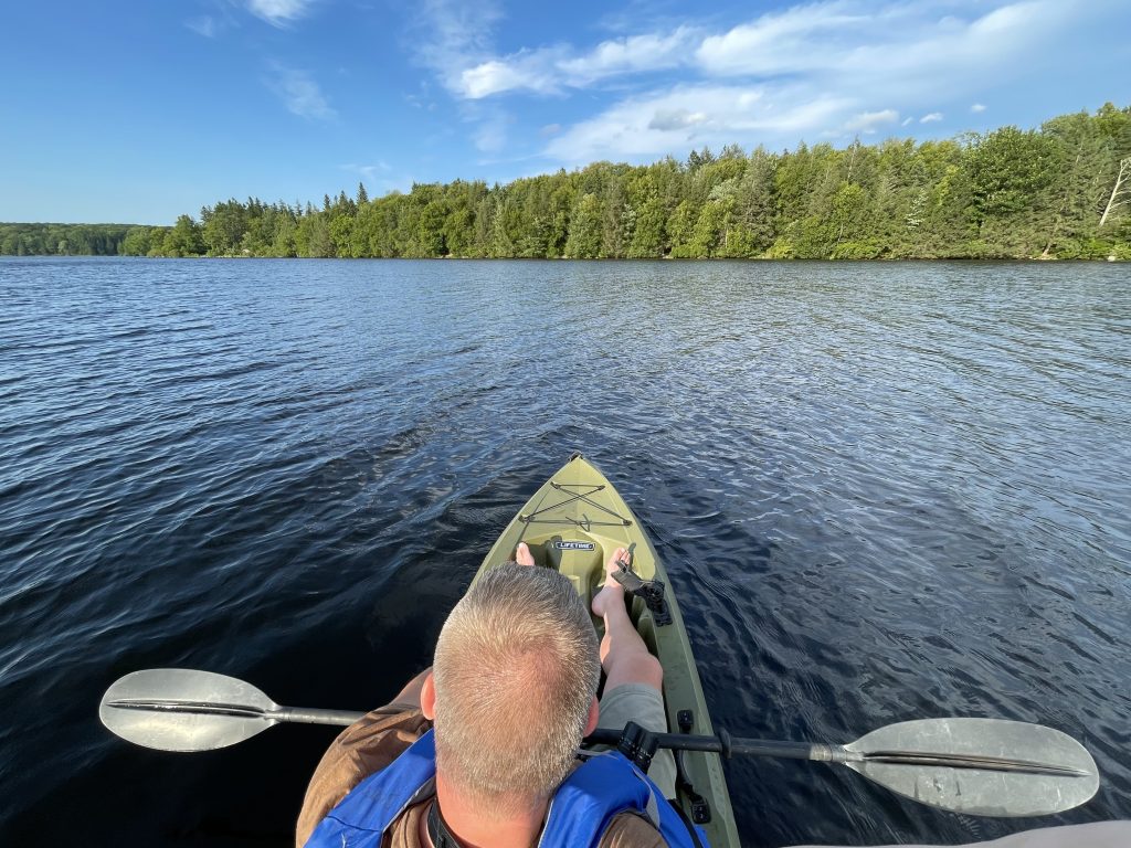 Me, from overhead, on a kayak, on a lake.