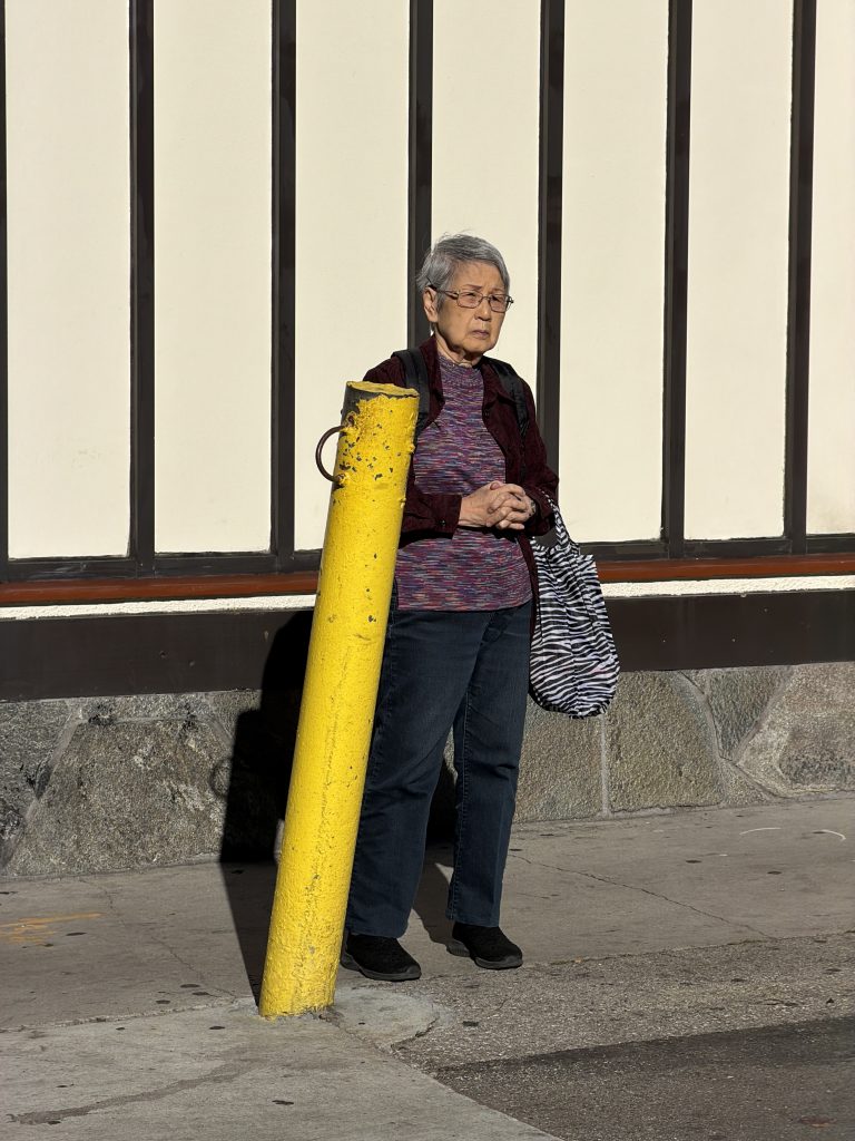 A woman waits patiently.